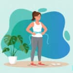 Someone measuring their weight loss with a tape measure